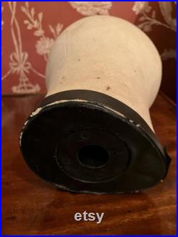 A cloth mannequin head, vintage, hat headdress wig stand, plastic base, table top.