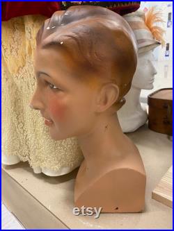 Mannequin for hats, 1920-1930, Europe. Ceramics. It has a beautiful face, short hair. The face is tanned. Expressive eyes.