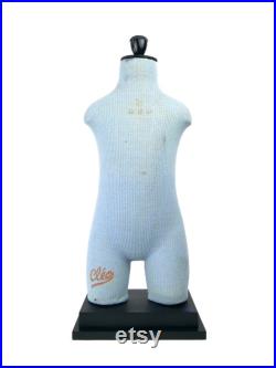 Old child Cléo mannequin on black wooden base Vintage collection Retro decoration 1950s