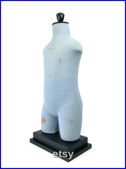 Old child Cléo mannequin on black wooden base Vintage collection Retro decoration 1950s