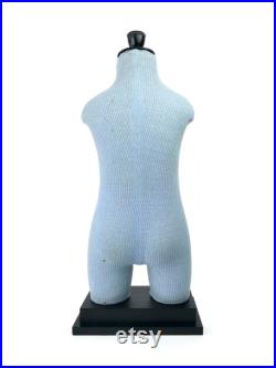 Old child Cléo mannequin on black wooden base Vintage collection Retro decoration 1950s