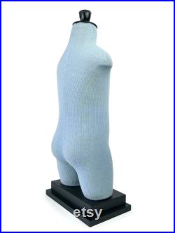 Old child Cléo mannequin on black wooden base Vintage collection Retro decoration 1950s