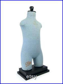 Old child Cléo mannequin on black wooden base Vintage collection Retro decoration 1950s