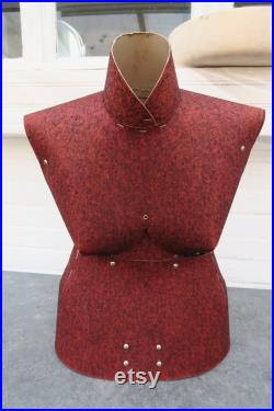 Old sewing mannequin in cardboard and red felt