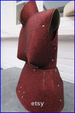 Old sewing mannequin in cardboard and red felt