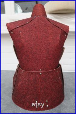 Old sewing mannequin in cardboard and red felt
