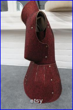 Old sewing mannequin in cardboard and red felt