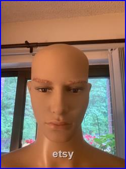 Realistic full body male mannequin with realistic facial features
