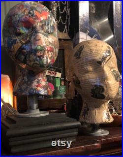 Showcase handcrafted display heads featuring decoupage and epoxy finishes, set upon a black wooden base