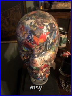 Showcase handcrafted display heads featuring decoupage and epoxy finishes, set upon a black wooden base