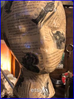 Showcase handcrafted display heads featuring decoupage and epoxy finishes, set upon a black wooden base