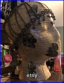 Showcase handcrafted display heads featuring decoupage and epoxy finishes, set upon a black wooden base