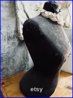 Very petite wasp waist mannequin dress form in faded black fabric with distressing. Does not come with crown neck piece.