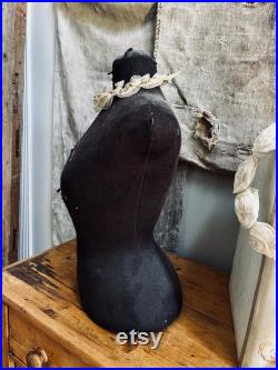 Very petite wasp waist mannequin dress form in faded black fabric with distressing. Does not come with crown neck piece.